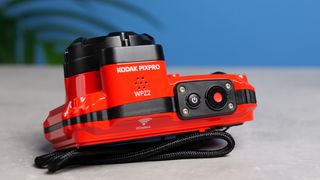 A red Kodak PIXPRO WPZ2 compact camera