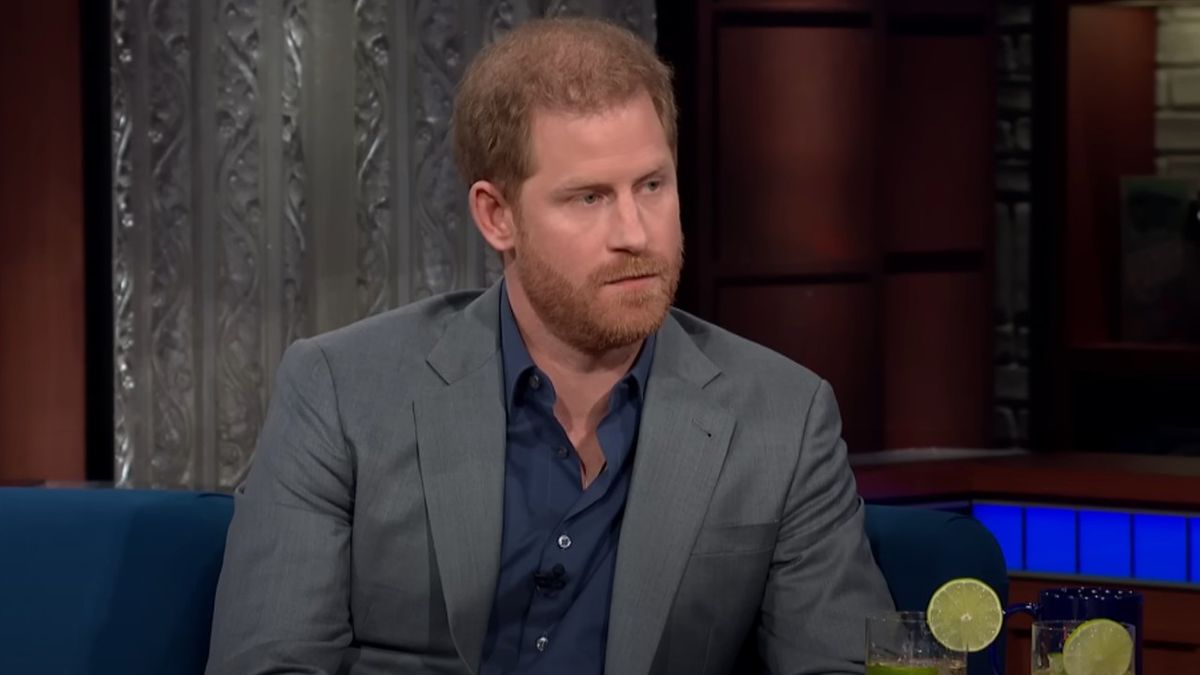 Prince Harry looking at Stephen Colbert