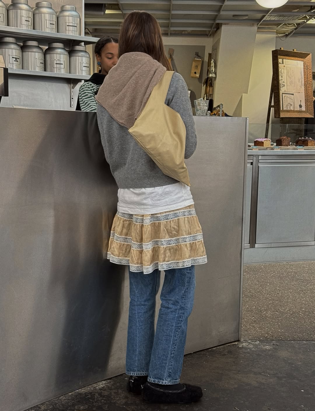 woman wearing medium wash cropped jeans trend