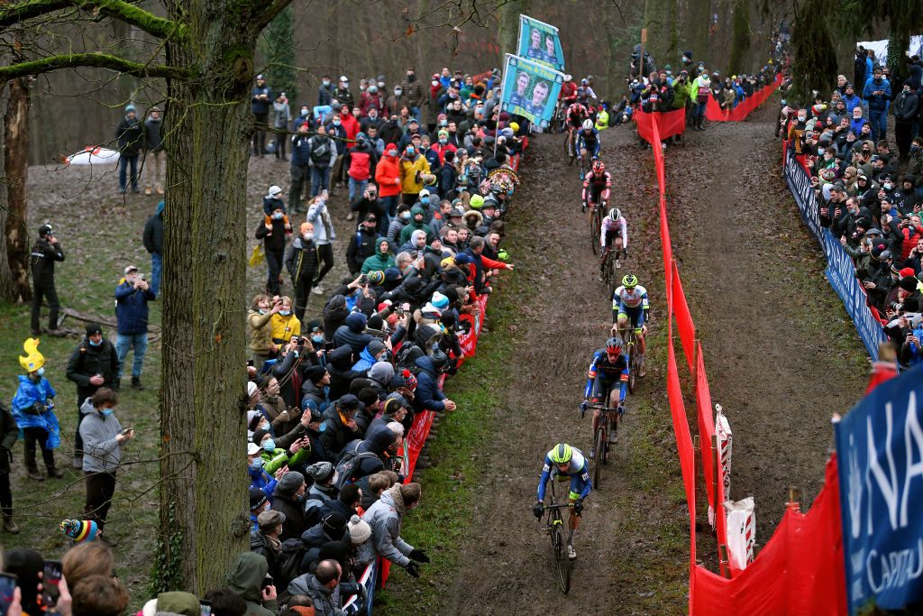 NAMUR BELGIUM DECEMBER 19 A general view of Quinten Hermans of Belgium and Tormans Cyclo Cross Team Toon Aerts of Belgium and Team Baloise Trek Lions Eli Iserbyt of Belgium and Team Pauwels Sauzen Bingoal Corne Van Kessel of The Netherlands and Tormans Cyclo Cross Team compete while fans cheer during the 13th Namur UCI CycloCross Worldcup 2021 Mens Elite UCIWT on December 19 2021 in Namur Belgium Photo by Luc ClaessenGetty Images
