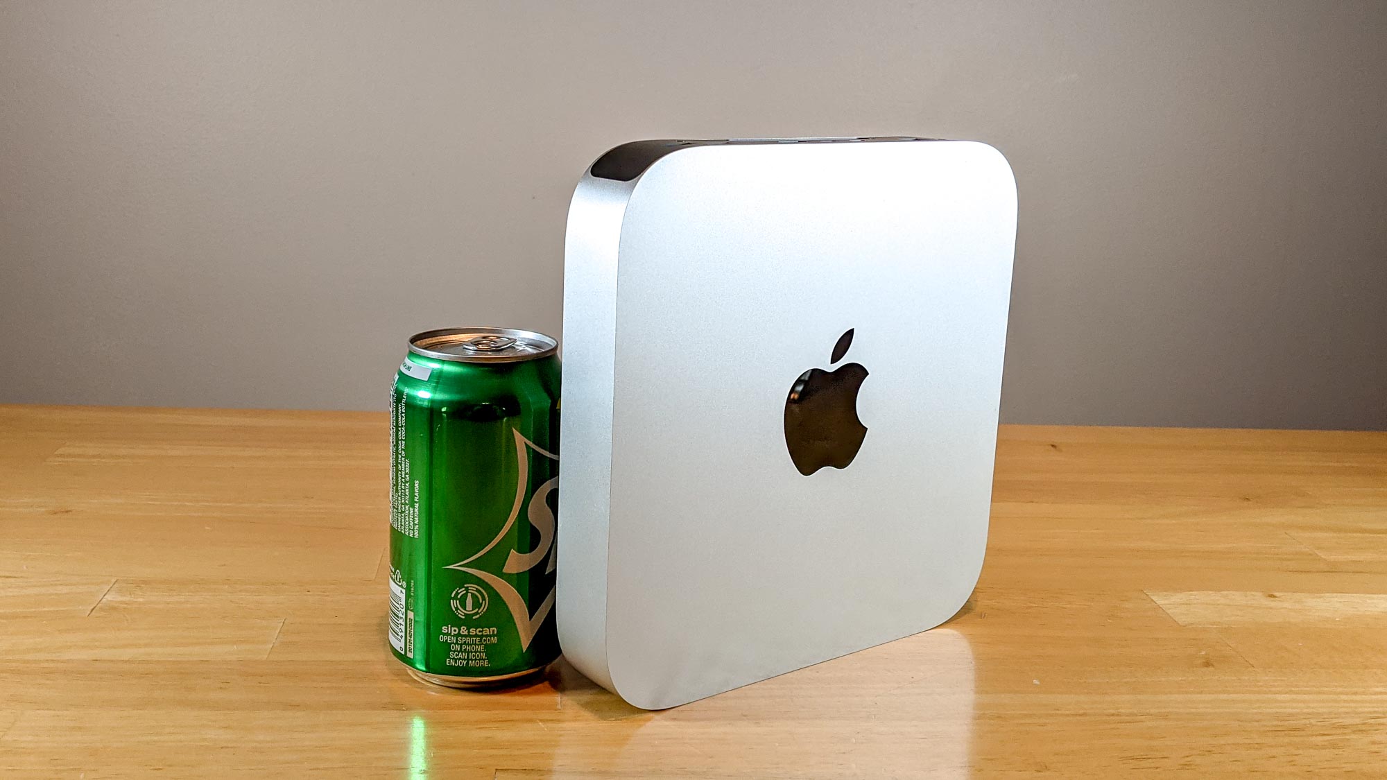 Mac Mini on a desk next to a soda can