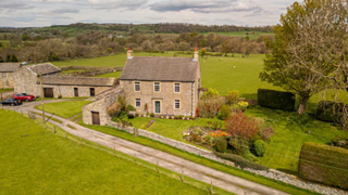 Georgian farmhouse with stone barn