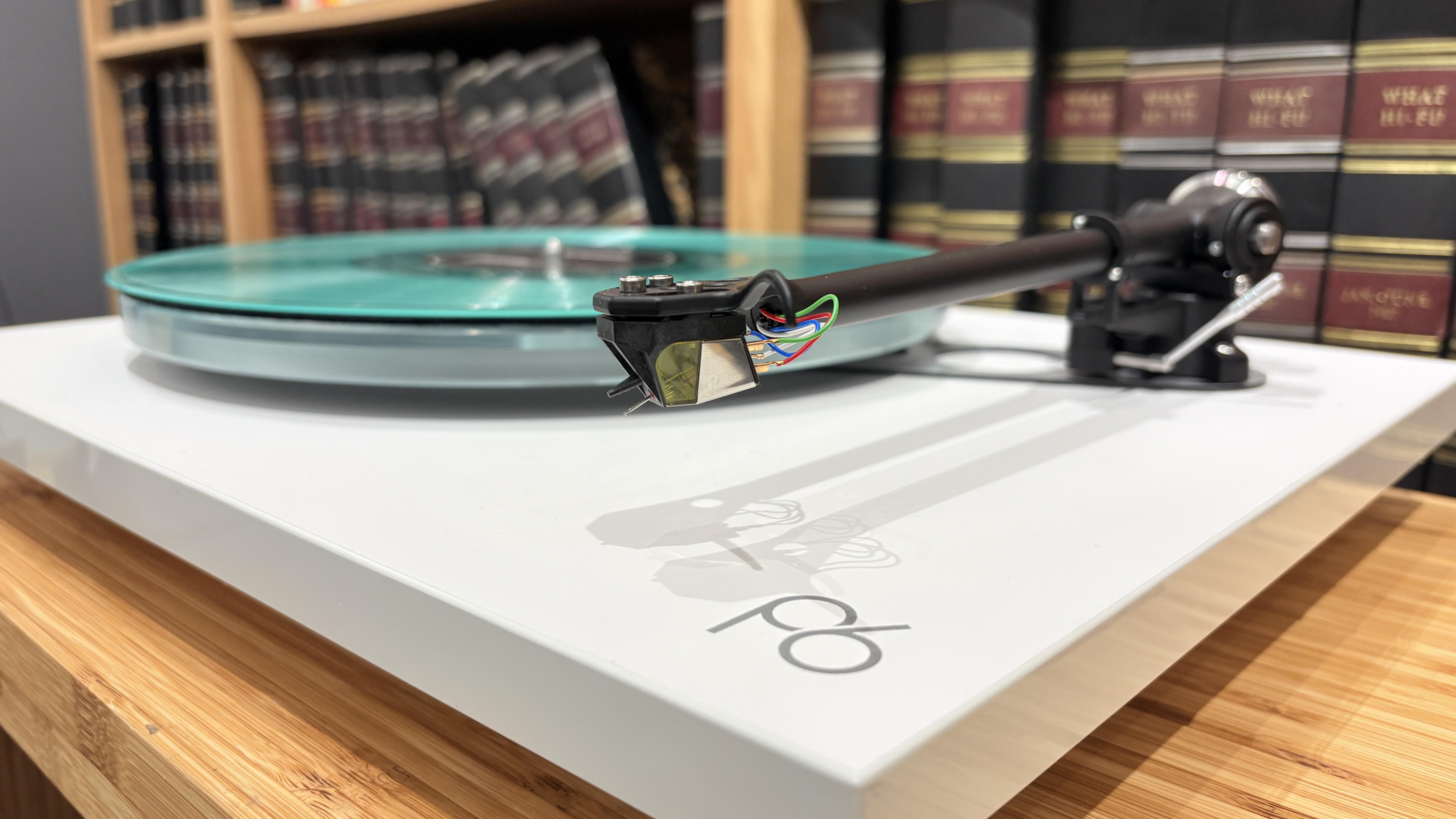 Rega Planar 6/Nd7 in white finish with blue vinyl record playing