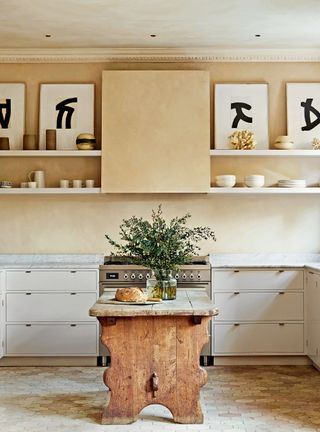 French country kitchen with neutral walls and open shelving