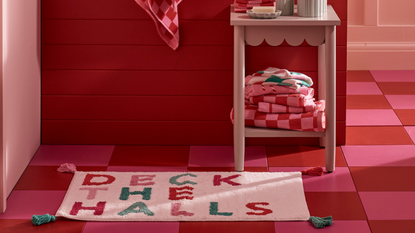 deck the halls bathmat in pink bathroom