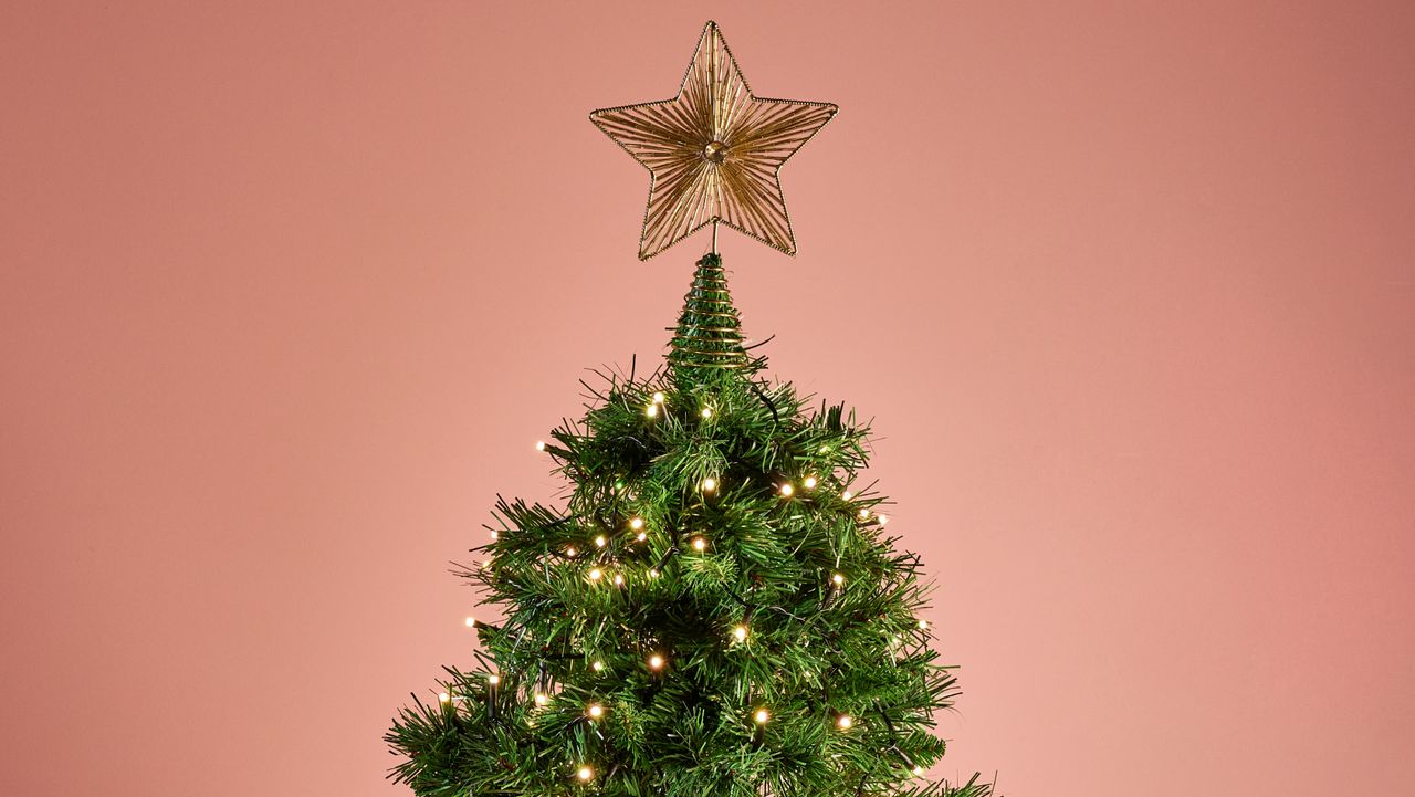 The Philips Hue Festavia String Lights are glowing white on a Christmas tree.