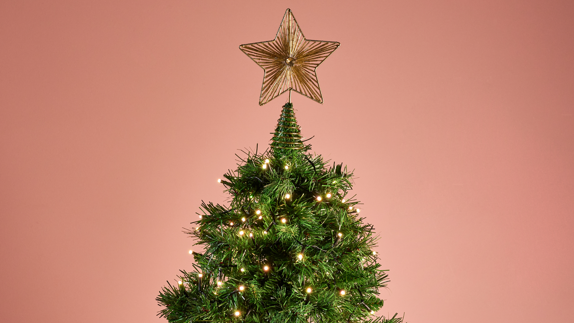 The Philips Hue Festavia String Lights are glowing white on a Christmas tree.