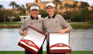 Bernhard and Jason Langer pose with the PNC Championship belts