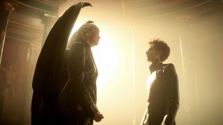 Lucifer stands over Morpheus in her throne room in Hell in Netflix's The Sandman