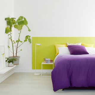 bedroom paint ideas, lime and white bedroom with purple bedding, plant