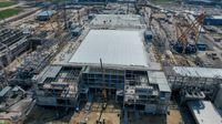 Aerial view of cranes and steel-frame buildings under construction at Intel’s Kiryat Gat site in Israel
