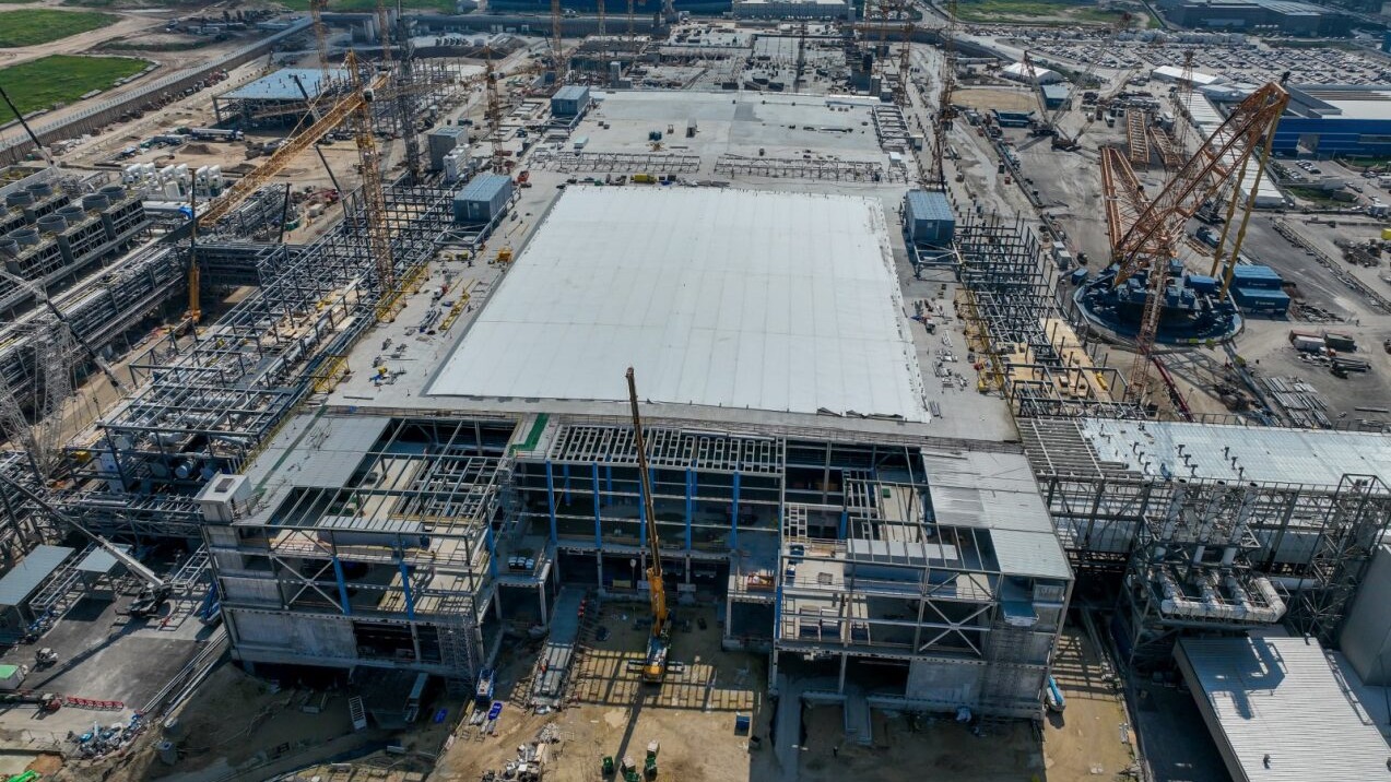 Aerial view of cranes and steel-frame buildings under construction at Intel&rsquo;s Kiryat Gat site in Israel