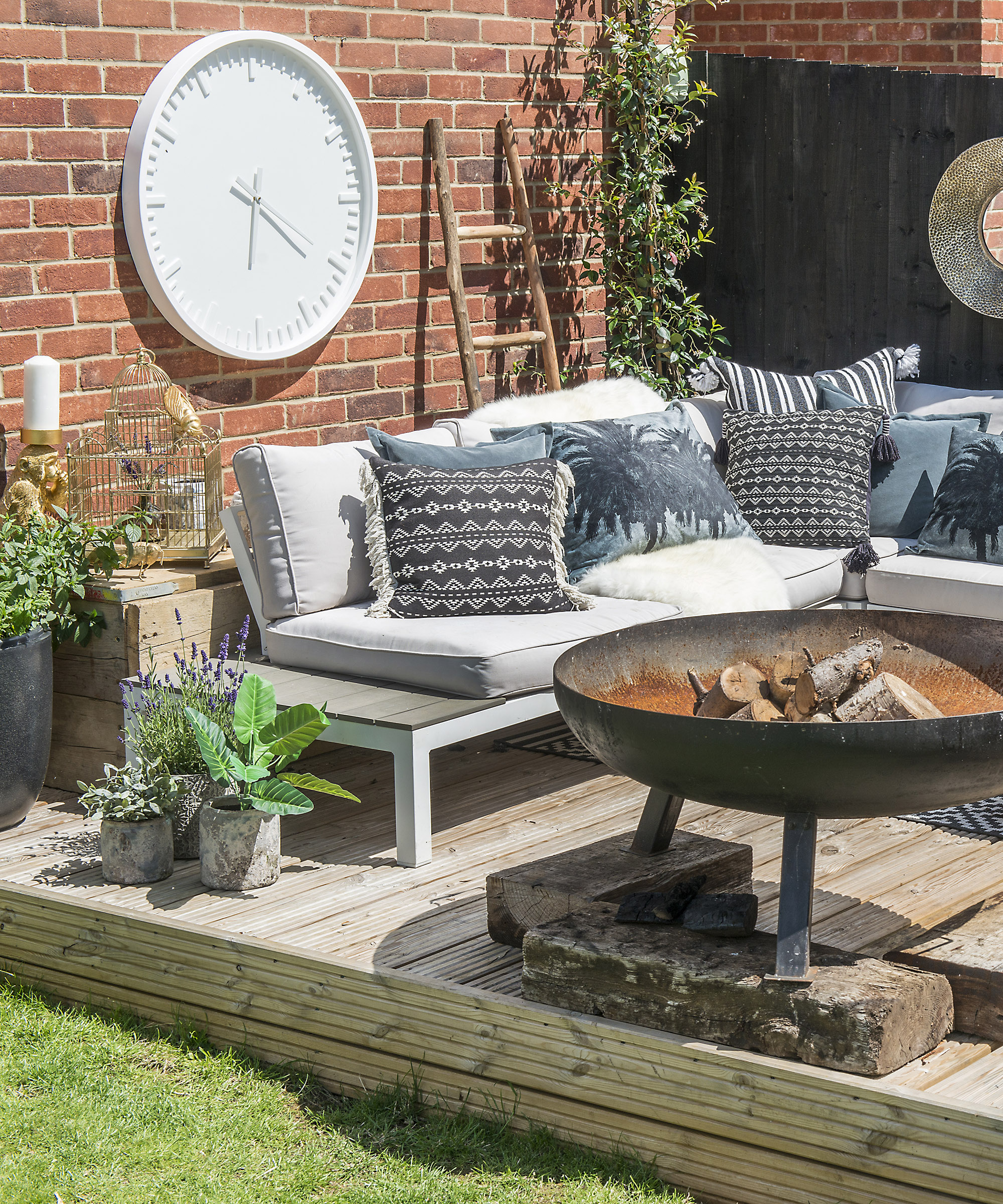 outdoor living room with clock mounted on wall