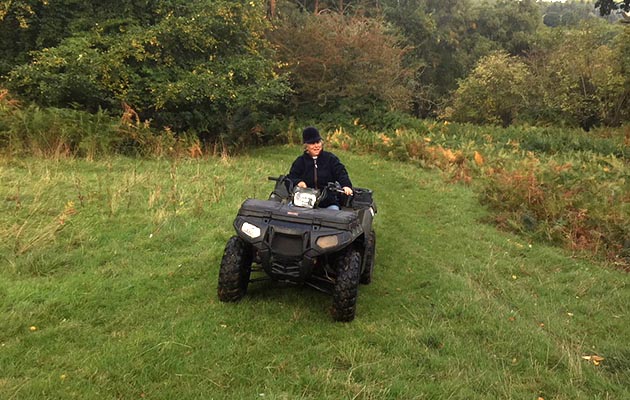 Patty Allen MFH mounted astride 4 wheels instead of 4 legs!