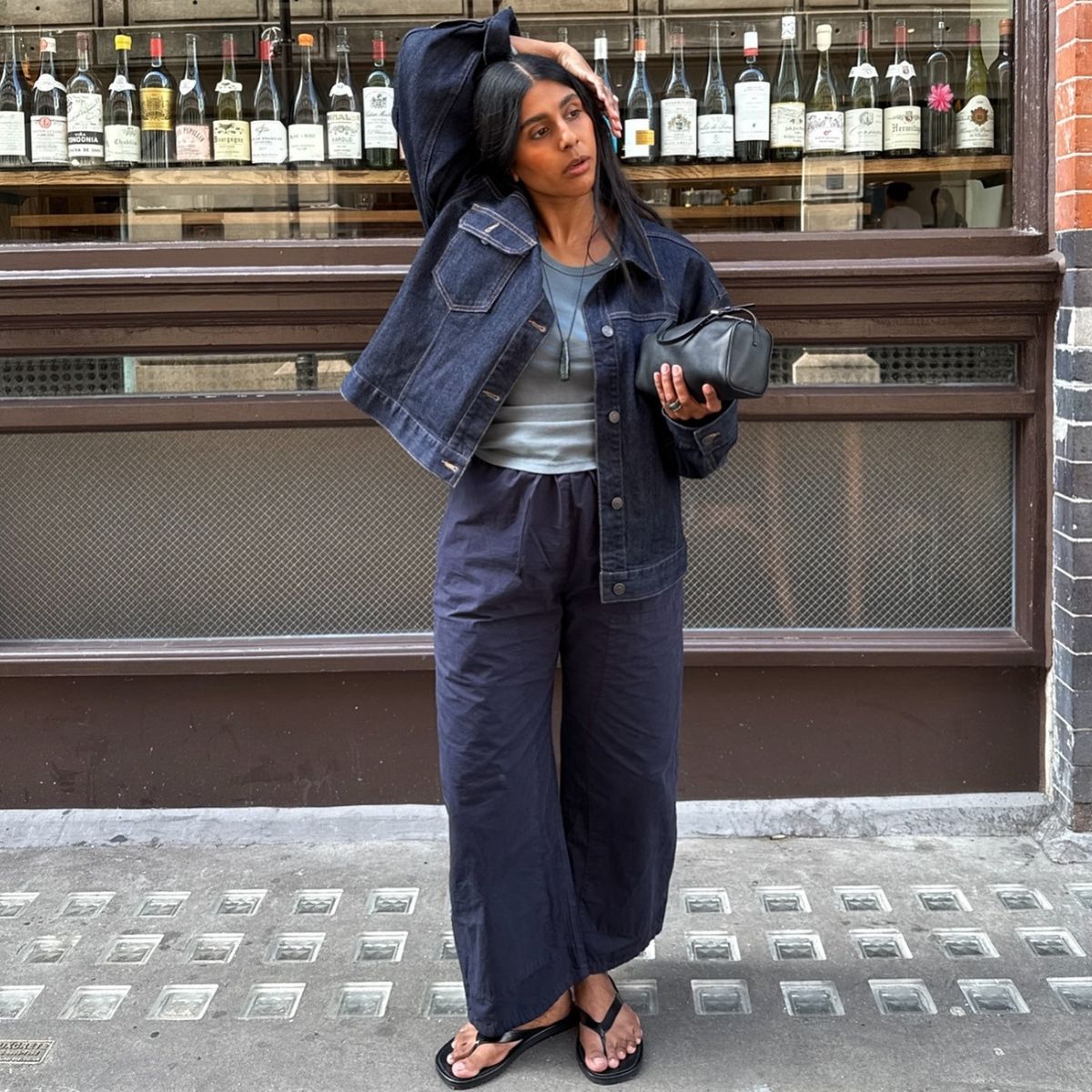 Monikh wearing leset trousers in navy