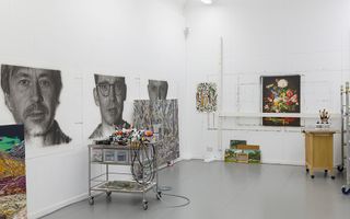 studio with white walls and black and white portraits