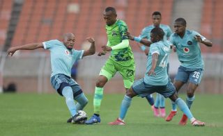 Thabo Mnyamane is challenged by Goodman Mosele