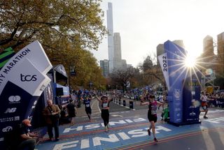 Runners cross the finish line of the TCS 2022 New York City Marathon