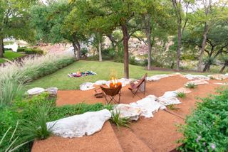 fall backyard ideas with firepit and picnic by Eden Garden Design