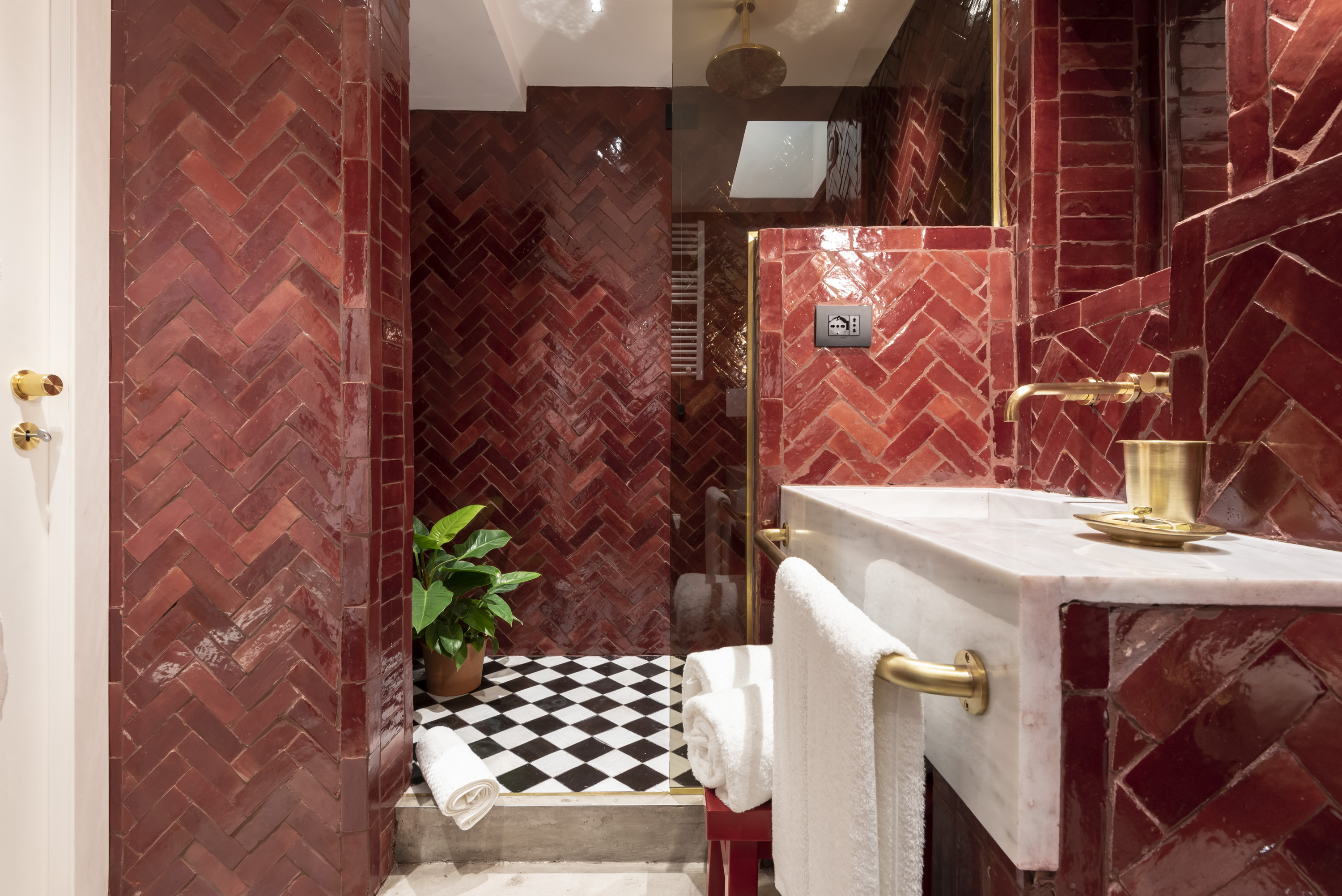 Red-tiled hotel bathroom