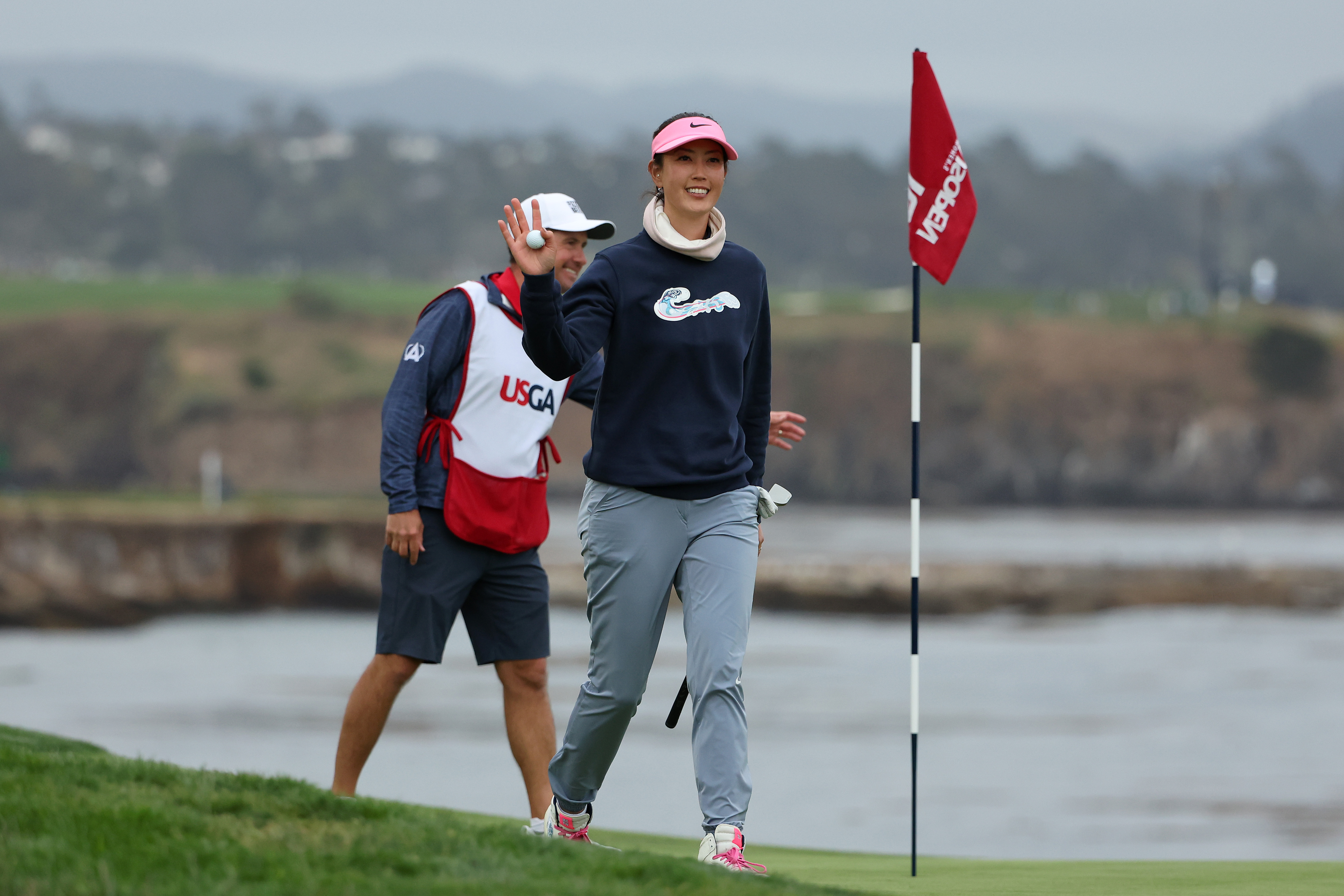 PEBBLE BEACH, CALIFORNIA - JULY 07: Michelle Wie West of the United States waves after making her long putt for par on the 18th green during the second round of the 78th U.S. Women&amp;amp;apos;s Open at Pebble Beach Golf Links on July 07, 2023 in Pebble Beach, California. (Photo by Ezra Shaw/Getty Images)