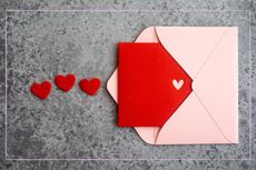 a Valentine's Day card with an open envelope and felt hearts 