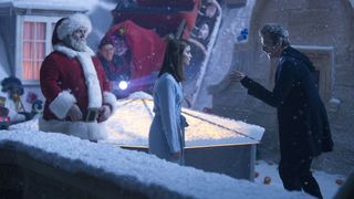 The Doctor tells Clara off while Santa watches in Last Christmas