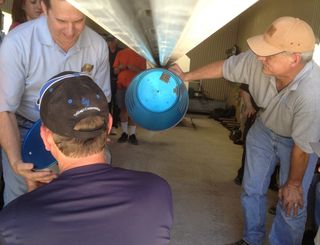 UP Aerospace personnel load a technology payload into the nose of the firm's SpaceLoft 7 suborbital rocket at Spaceport America in New Mexico. The rocket is slated to carry seven experiments into suborbital space on June 21, 2013.