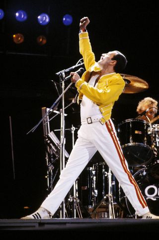 Freddie Mercury strutting the stage during Queen's massive 1986 tour.