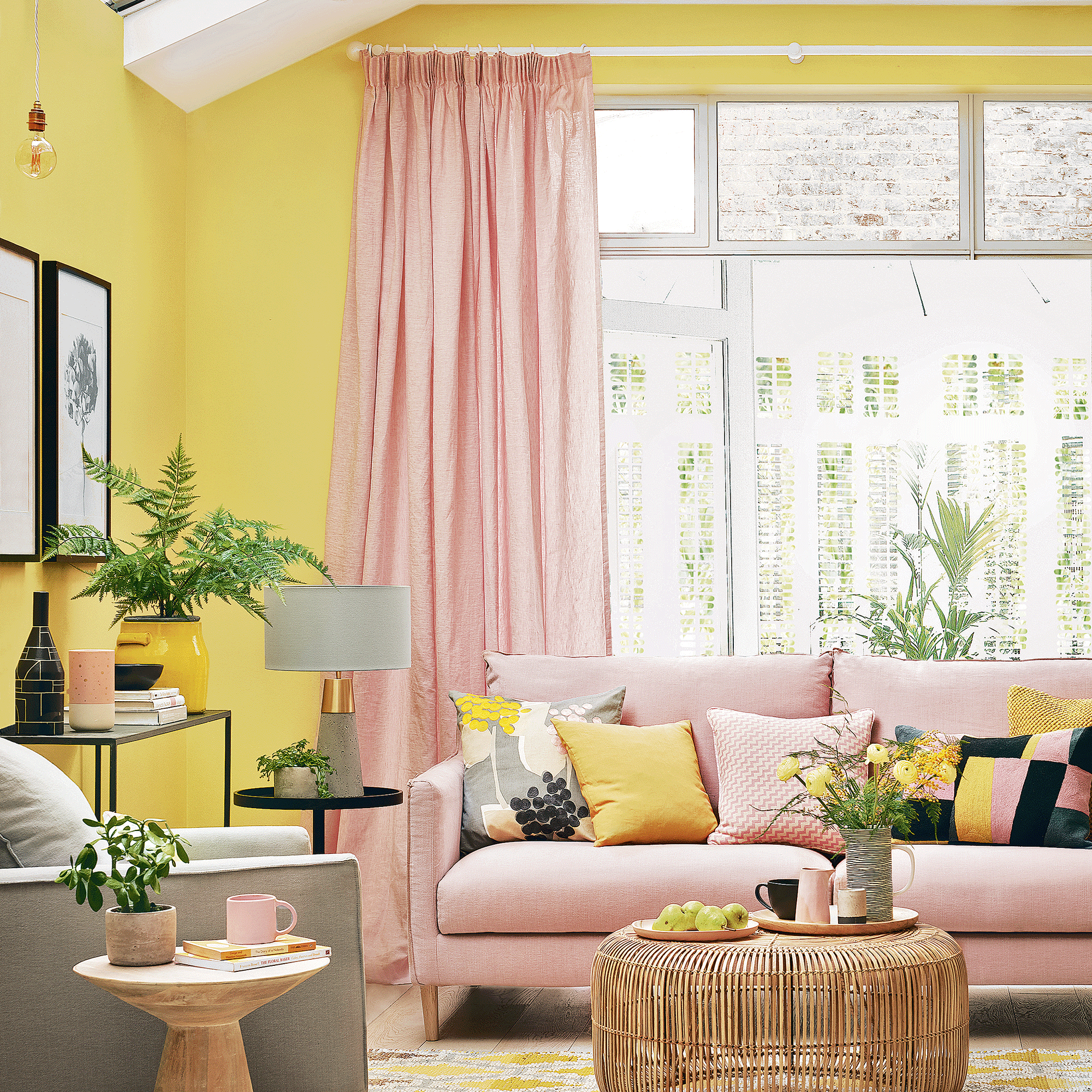 Yellow living room with pink curtains