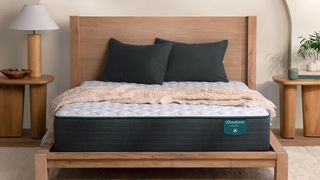 Image shows the Beautyrest Harmony Mattress on a wooden bedframe