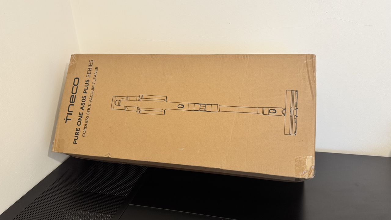 The Tineco Pure One A50S Plus vacuum cleaner box on a black table
