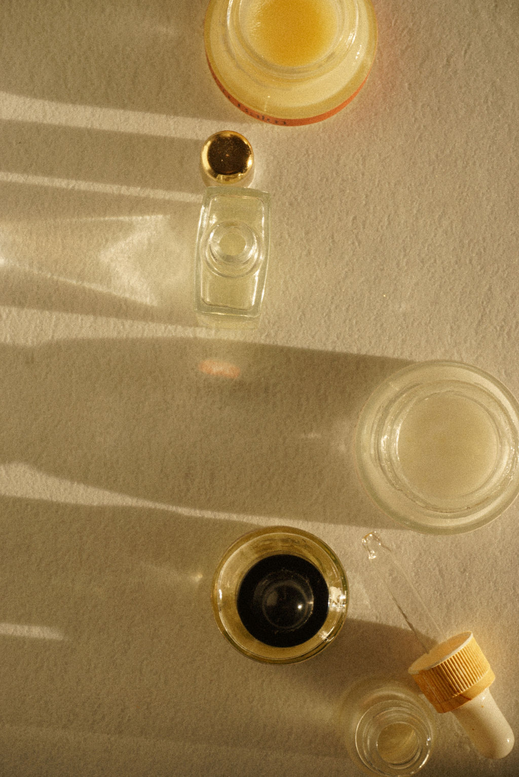 Skincare bottles on a table.