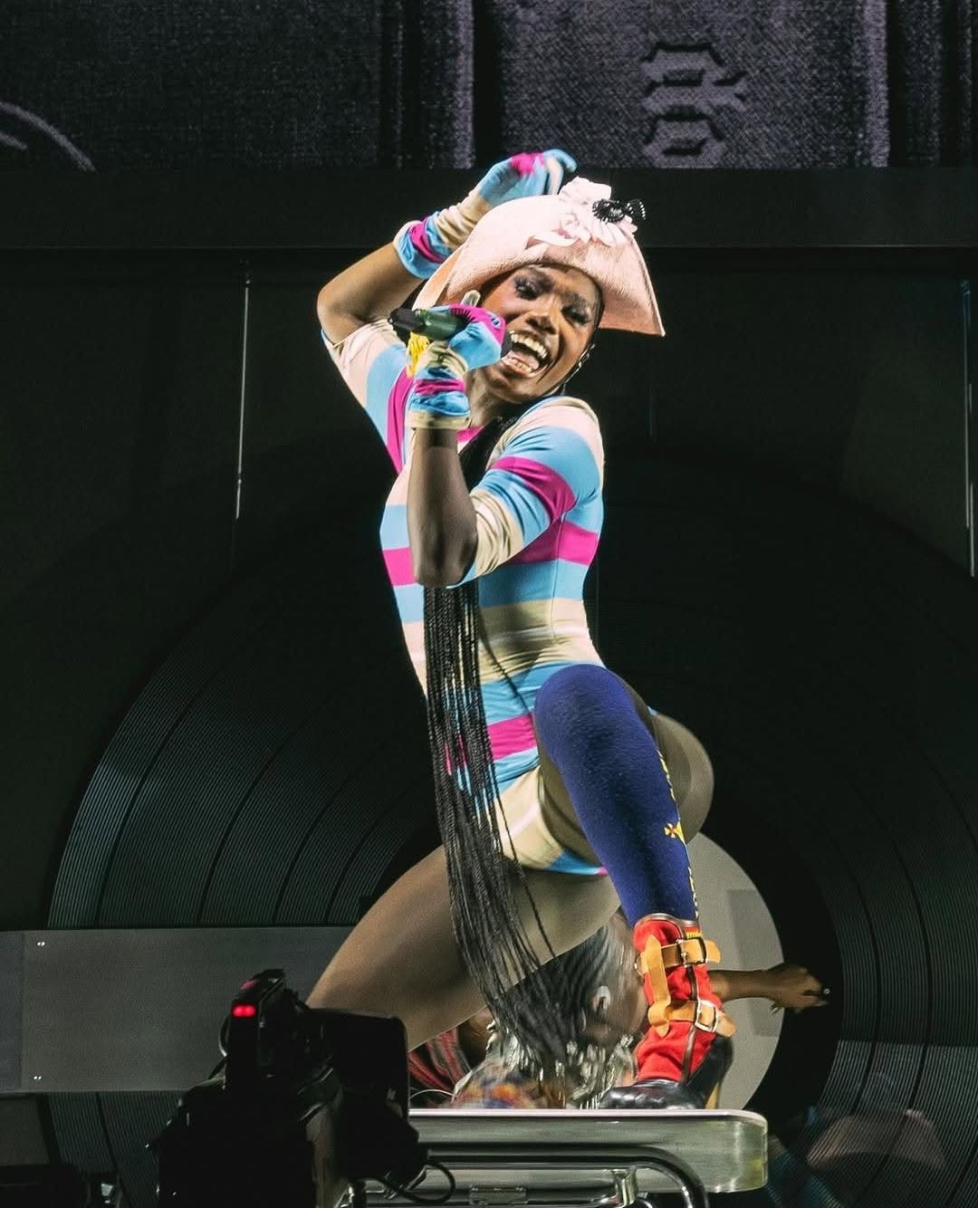 Doechii closed her Glastonbury performance in a custom Vivienne Westwood outfit inspired by the Spring 1994 "Cafe Society" collection.