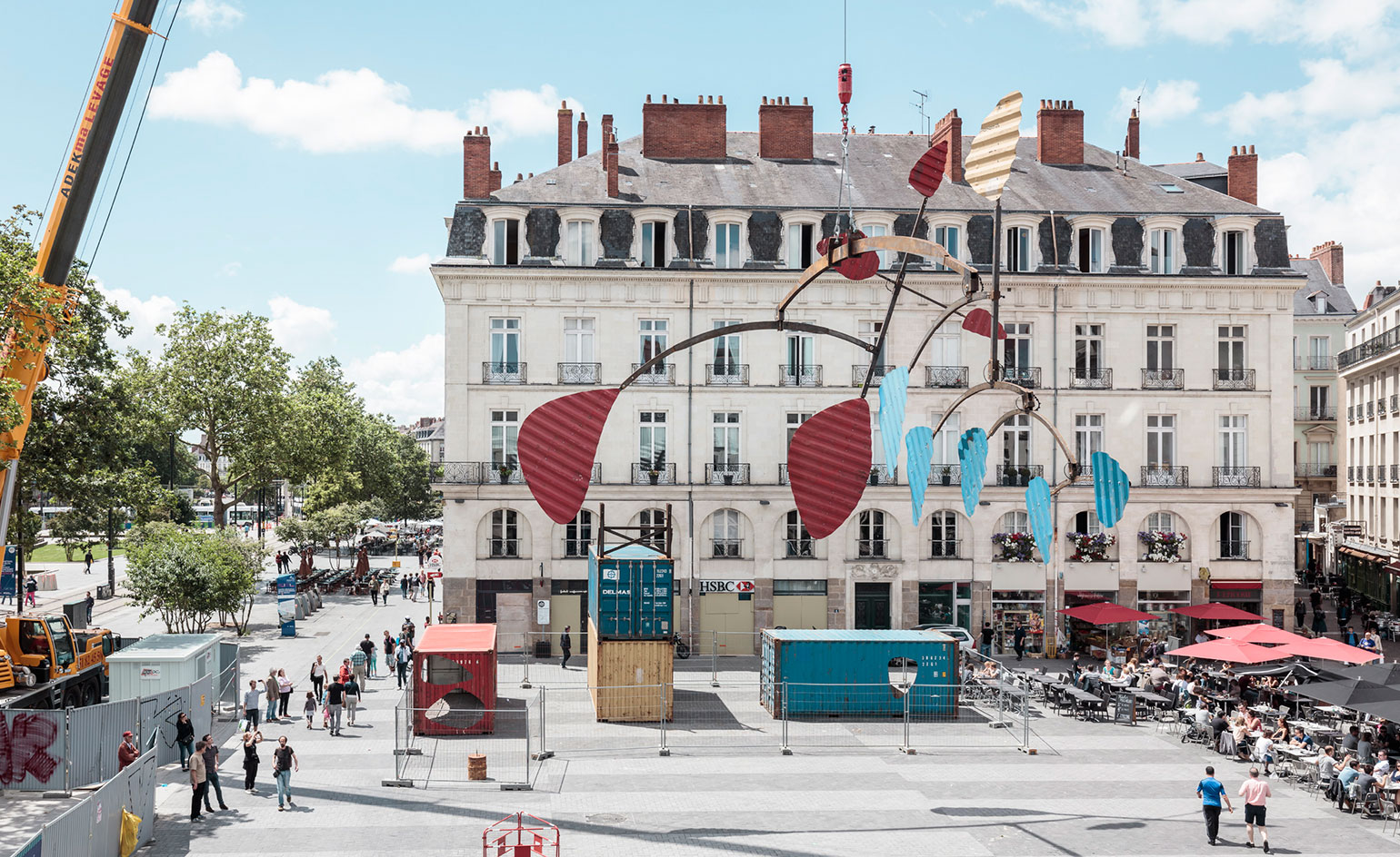 A gigantic Calder-esque mobile next to a building