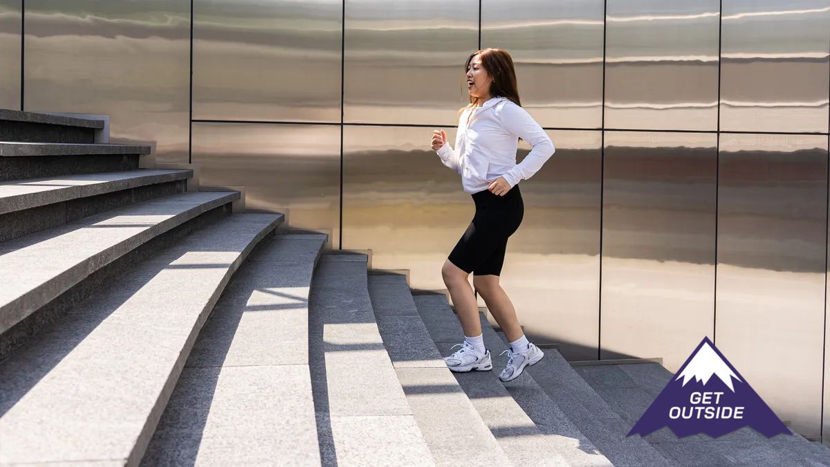 a woman walking up a set of stairs