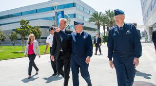 Deputy Defense Secretary Patrick Shanahan speaks with Air Force Lt. Gen. John Thompson, commander of the Space and Missile Systems Center Aug. 27, 2018.