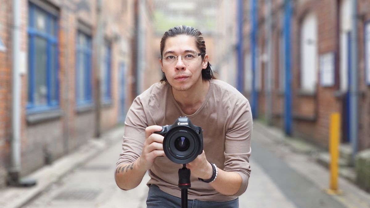 James Artaius using one of the best Canon cameras on a tripod in a street environment