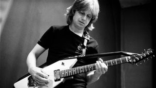 Swedish guitarist Janne Schaffer performs with a Roland G-707 guitar synthesizer controller in 1984.