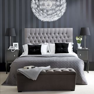 bedroom with grey colour and white flooring