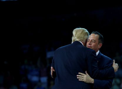 Republican National Committee chairman Reince Priebus embraces Donald Trump.