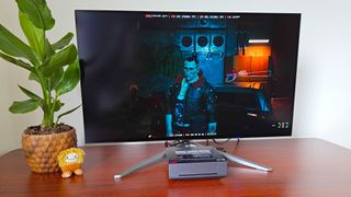 Ayaneo Mini PC AM02 running Cyberpunk 2027 with Jackie on screen