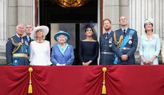 Prince Charles, Prince of Wales, Prince Andrew, Duke of York, Camilla, Duchess of Cornwall, Queen Elizabeth II, Meghan, Duchess of Sussex, Prince Harry, Duke of Sussex, Prince William, Duke of Cambridge and Catherine, Duchess of Cambridge watch the RAF flypast on the balcony of Buckingham Palace, as members of the Royal Family attend events to mark the centenary of the RAF on July 10, 2018 in London, England.
