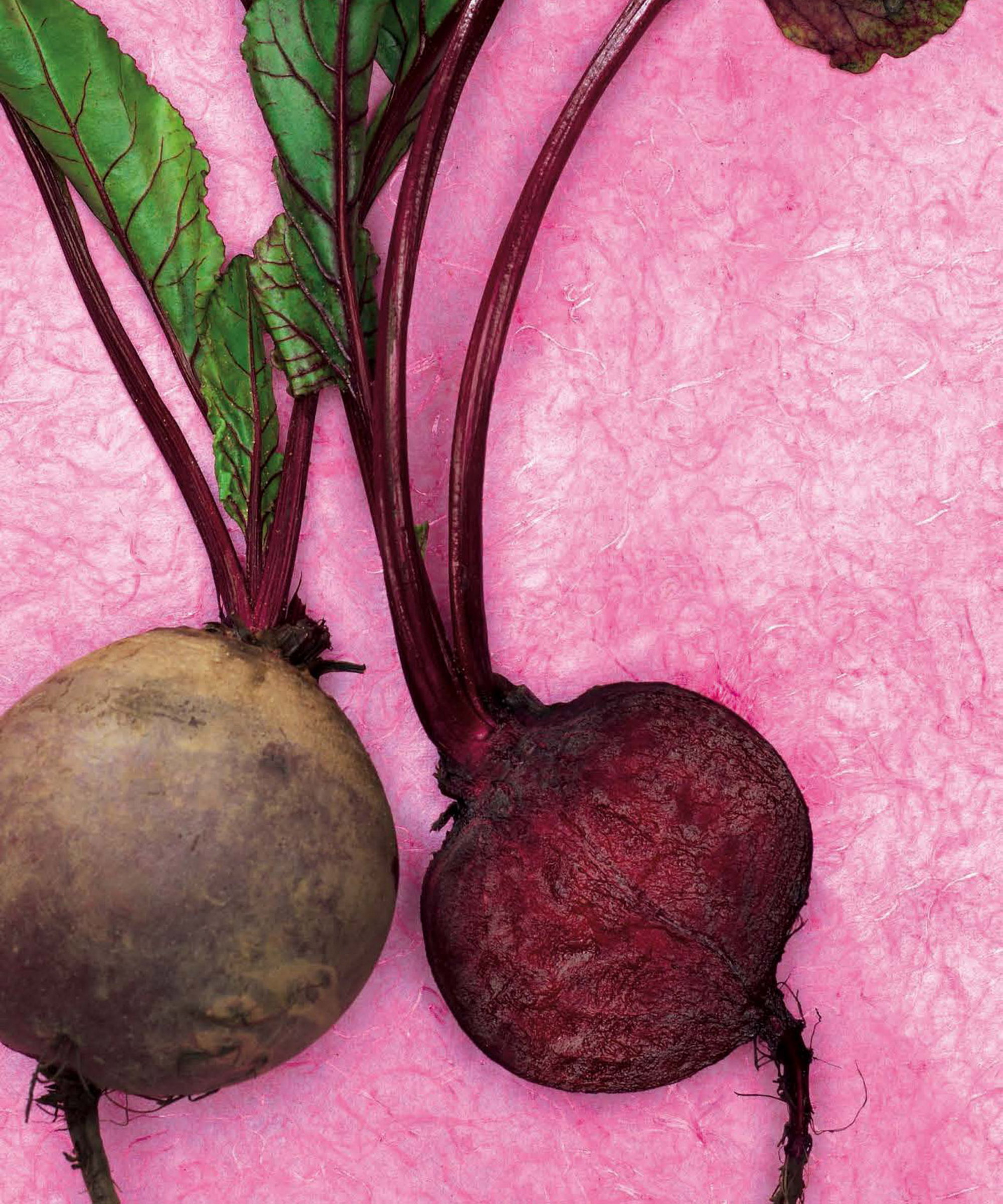 A chopped beet on a pink background