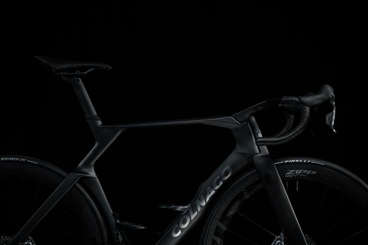 shadowy shots of a black Colnago bike on a black background