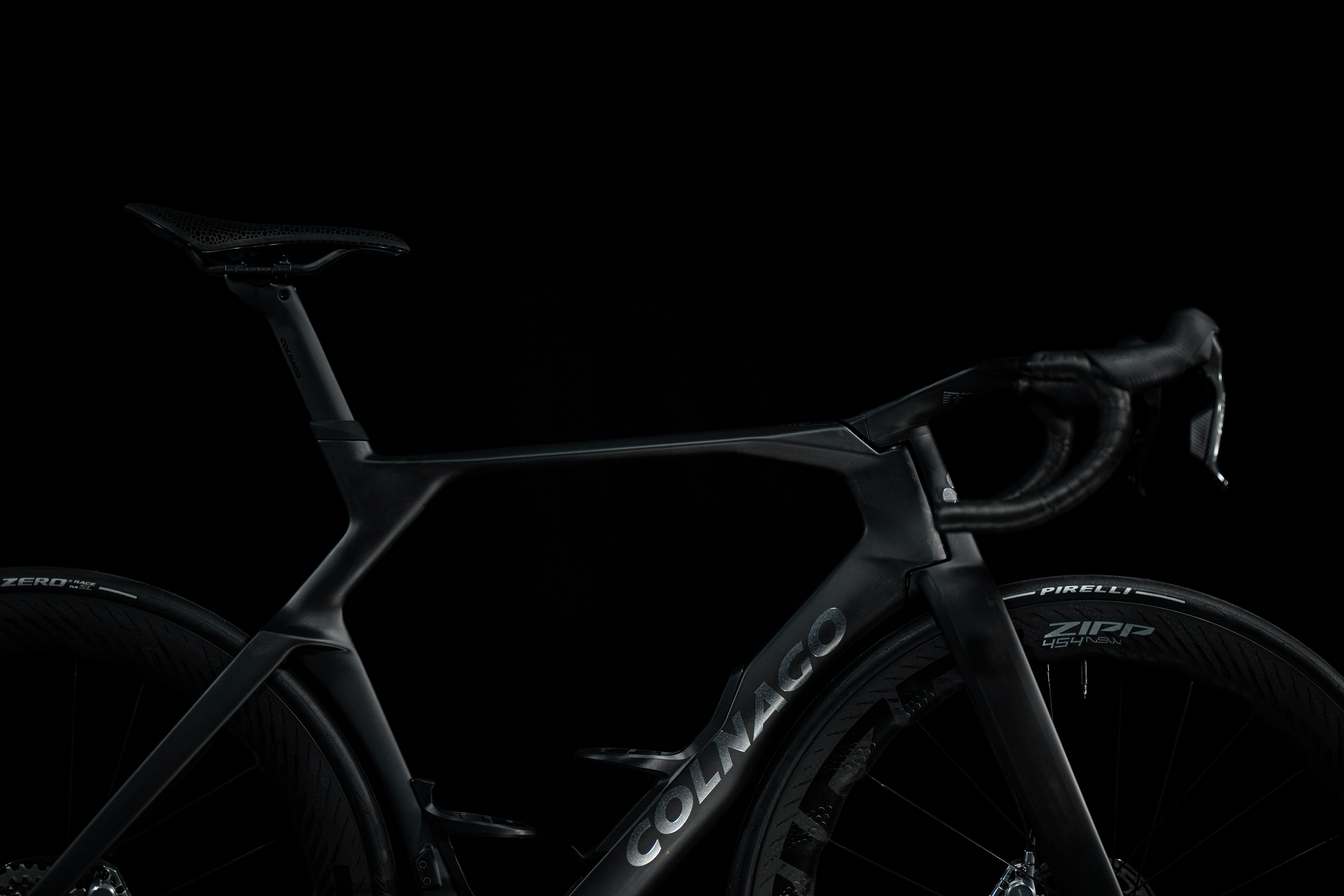 shadowy shots of a black Colnago bike on a black background