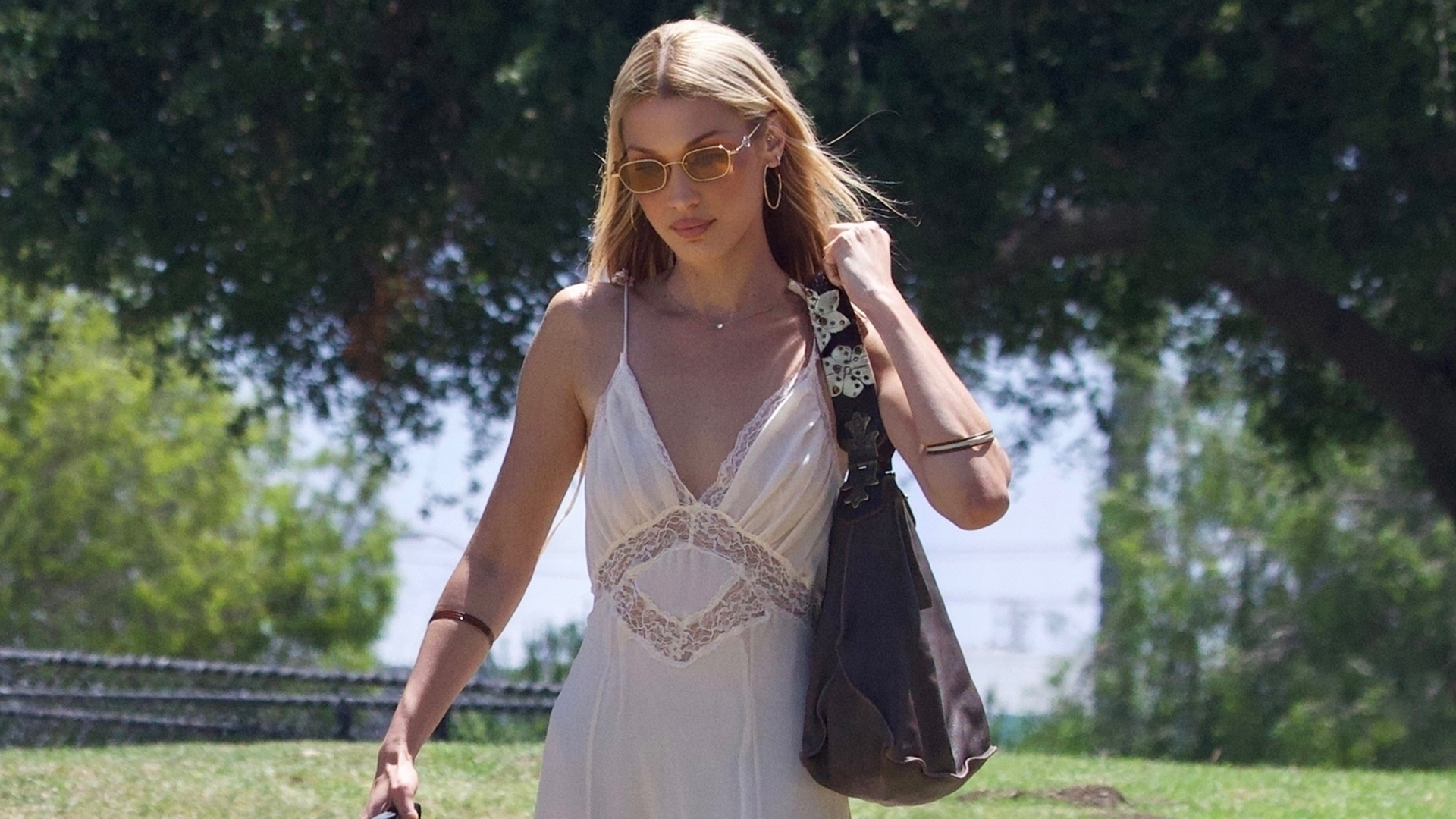 Bella Hadid's country-ified aesthetic took a bohemian turn with a lacy little white dress and cowboy boots