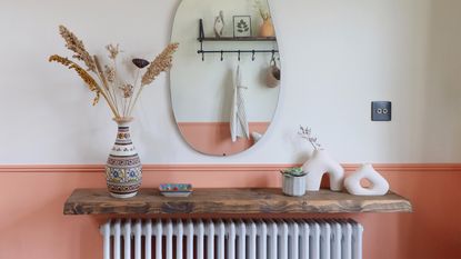 A two-toned hallway wall in Lick White 05 and Lick Orange 05