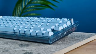 A glacier blue Corsair K65 Plus wireless mechanical keyboard for Mac