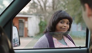 Ma Octavia Spencer looking harmless through the window of a truck